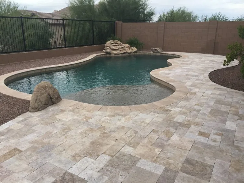 Freeform pool shapes with warm natural decking